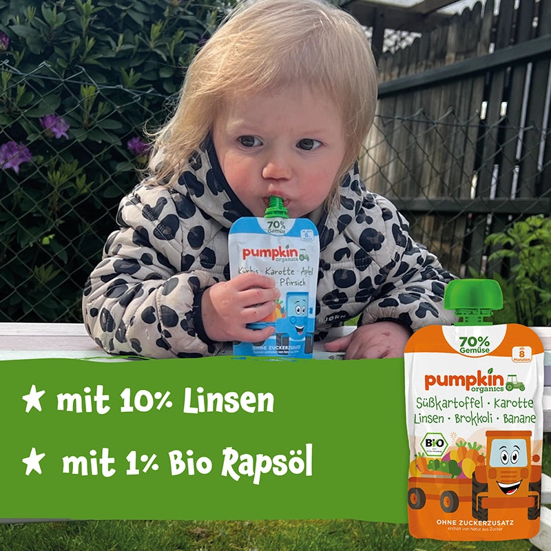 Kleines Kind isst Gemüse-Quetschie mit 10% Linsen und 1% Bio Rapsöl